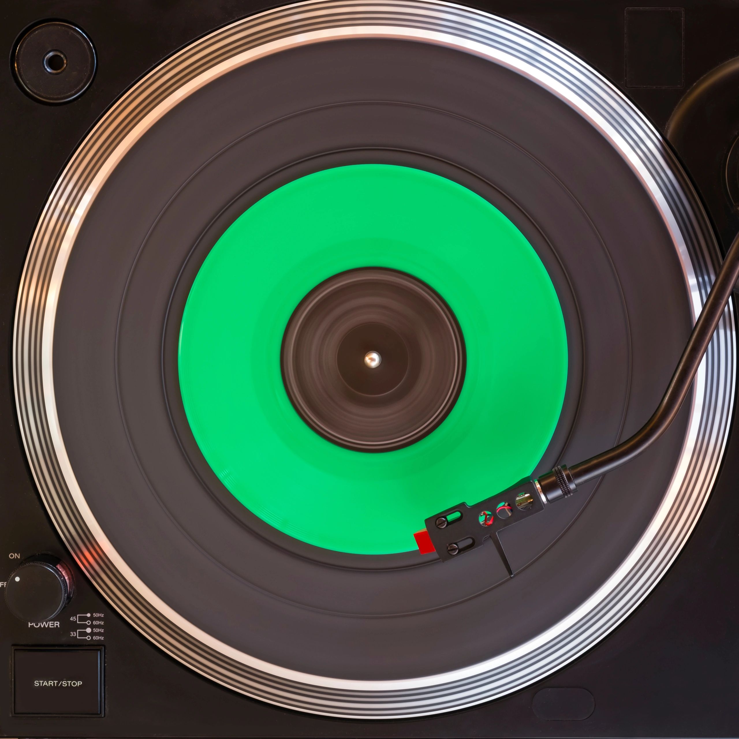 Directly Above Shot Of Record Playing On Turntable